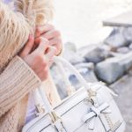 Beige Sweater White Handbag Stone Water background image & Google Slides Theme