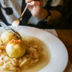 Beige dumplings on sauerkraut background image & Google Slides Theme