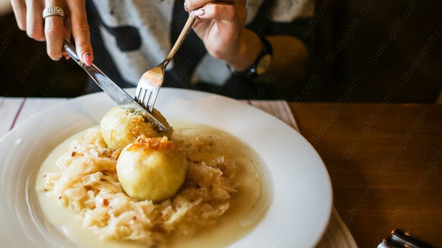 Beige dumplings on sauerkraut background image