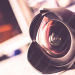 Black Camera Lens Blurry Multicolor background image & Google Slides Theme