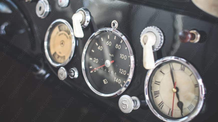 Black and Silver Dials Car Instrument Panel background image