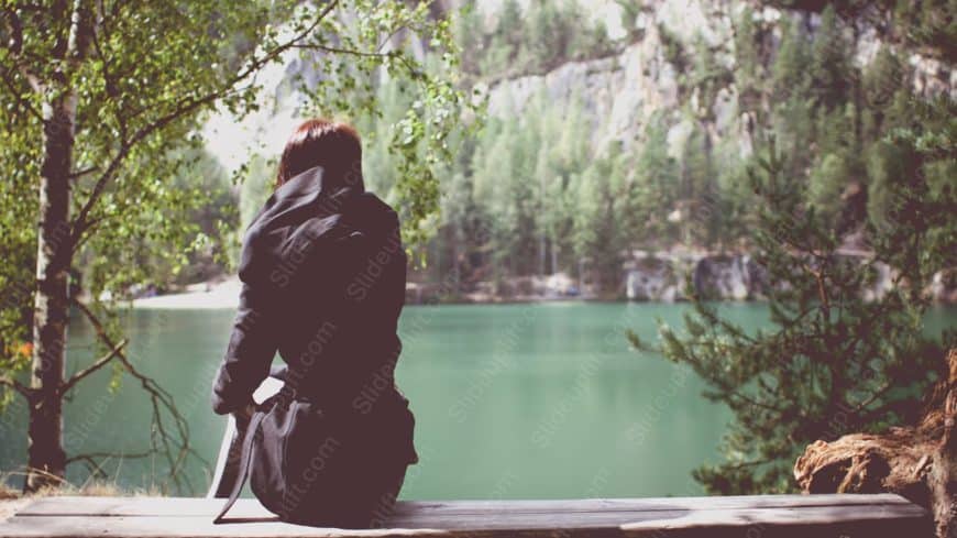 Black cloaked person lake background image