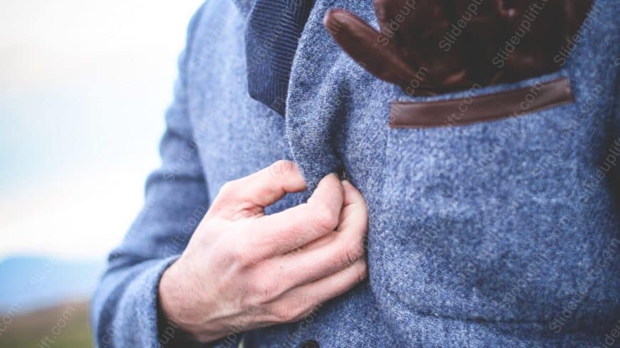 Blue Grey Jacket and Brown Leather Hand background image