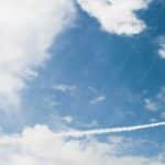 Blue Sky White Clouds Red Black Airplane background image & Google Slides Theme