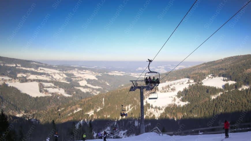 Blue sky white snow green trees ski lift background image
