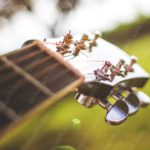 Brown Guitar Headstock Green Blur background image & Google Slides Theme