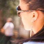 Brown Hair and Sunglasses Candid background image & Google Slides Theme