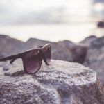 Brown Sunglasses Seaside background image & Google Slides Theme