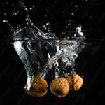 Brown Walnuts Splash Dark background image & Google Slides Theme