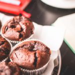 Chocolate brown muffins plate and book background image & Google Slides Theme