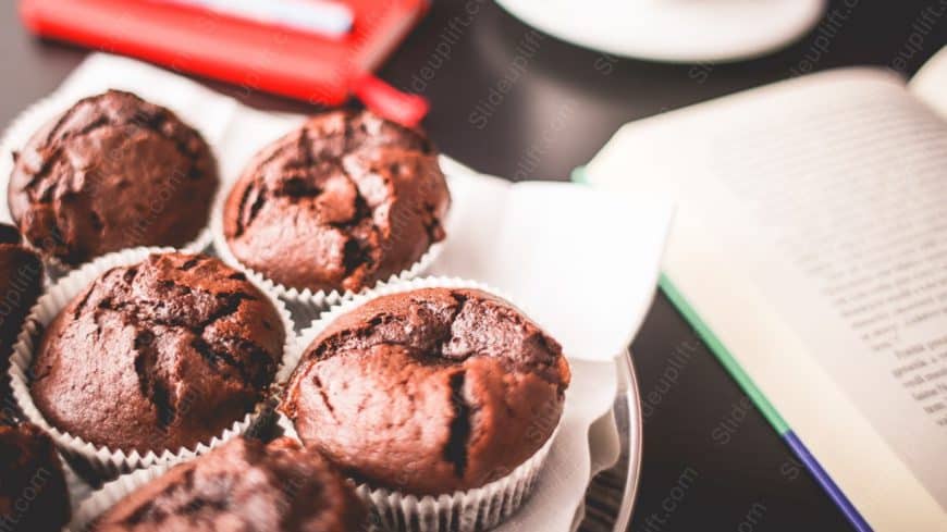 Chocolate brown muffins plate and book background image
