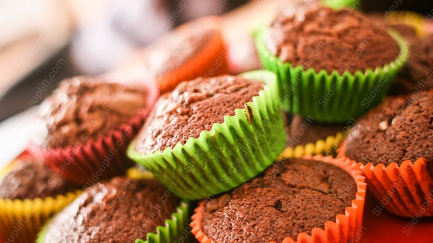 Chocolate muffins colourful cupcake liners background image