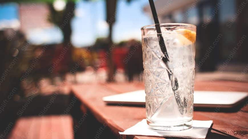 Clear glass with ice cubes wooden table background image