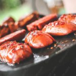 Glistening Mahogany Sausages Cooking background image & Google Slides Theme