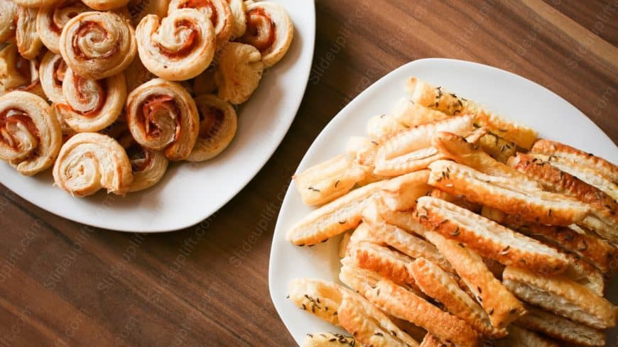 Golden Pastry Twists and Rolls Wooden Table background image