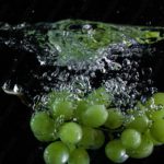 Green Grapes Water Splash Black background image & Google Slides Theme