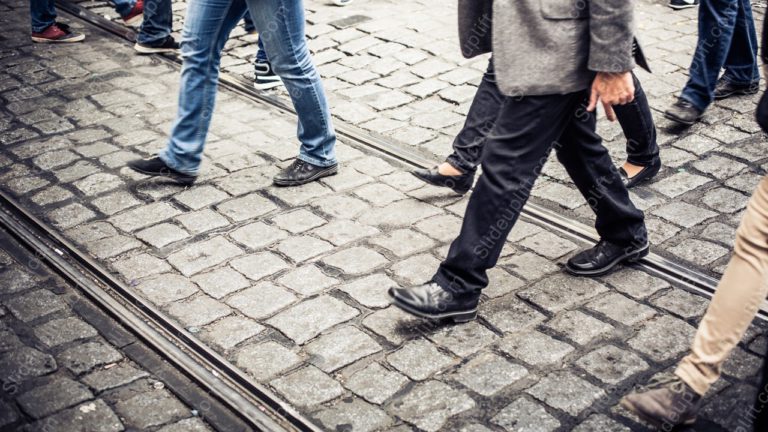 Greyscale WalkingFeet CobblestonePavement background image & Google Slides Theme