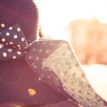 Navy Polka Dot Bow Tie and Straw Hat Warm Tones background image & Google Slides Theme