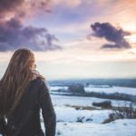 Peach Sunset Woman Snowy Field background image & Google Slides Theme