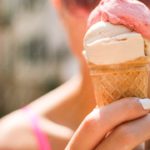 Pink White Ice Cream Cone Held by Hand background image & Google Slides Theme