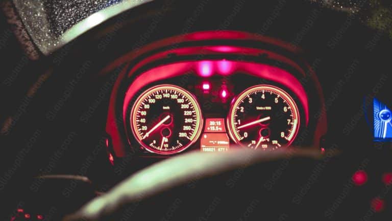 Red Glowing Speedometer and Tachometer Nighttime Driving background image & Google Slides Theme