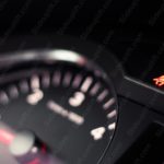 Red Seatbelt Indicator Dark Car Dashboard background image & Google Slides Theme