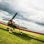 Red White Airplane Green Field background image & Google Slides Theme