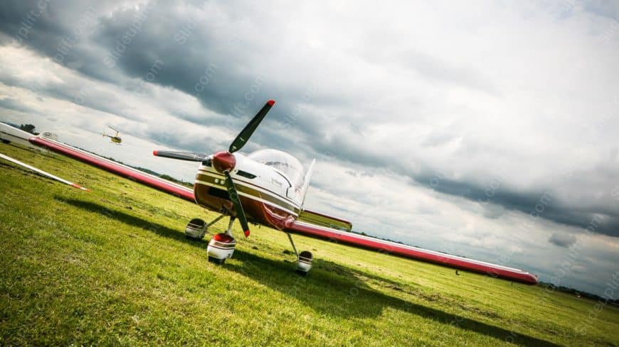 Red White Airplane Green Field background image