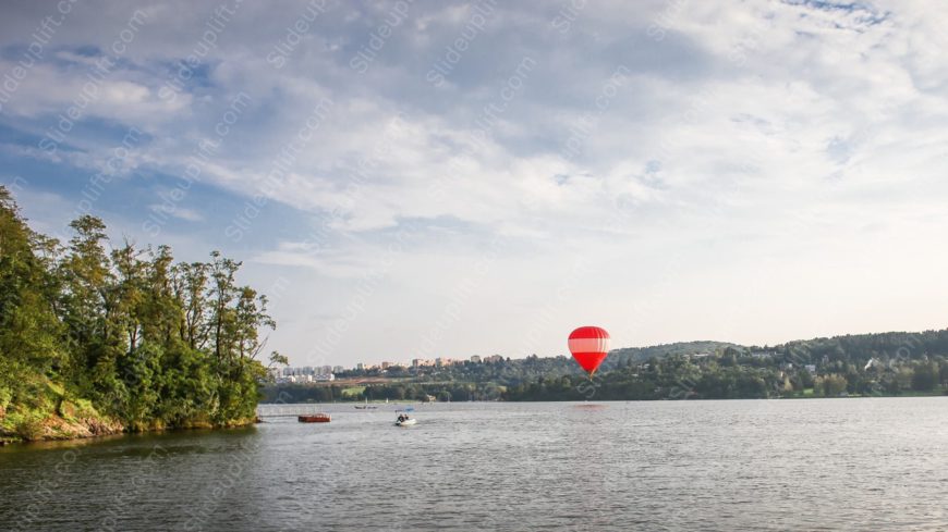 Red White Hot Air Balloon Lake Trees background image