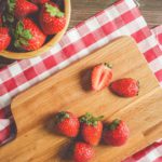 Red White Strawberries Wooden Board and Checkered Cloth background image & Google Slides Theme