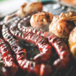 Reddish brown sausages and chicken background image & Google Slides Theme