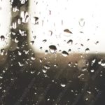 Sepia tone Raindrops Glass background image & Google Slides Theme