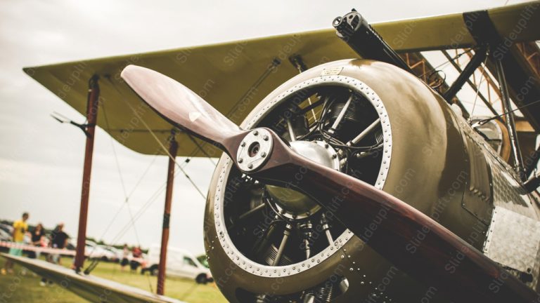 Silver Biplane Engine With Propeller Green Grass background image & Google Slides Theme