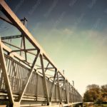 Silver Steel Bridge Blue Sky background image & Google Slides Theme