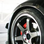 Silver wheel red brake caliper background image & Google Slides Theme