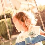 Sunset tinged Child Swing Garden background image & Google Slides Theme