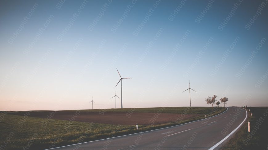 Twilight blue wind turbines countryside road background image