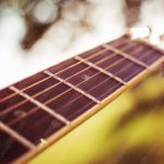 Warm brown guitar neck background image & Google Slides Theme