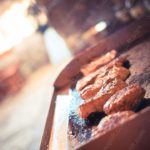 Warm brown meat and sausages cooking background image & Google Slides Theme