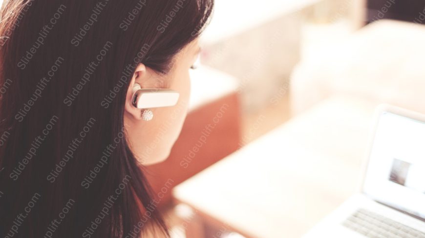 White earpiece woman with laptop background image