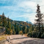 Amber Green Forest Road Cyclist background image & Google Slides Theme