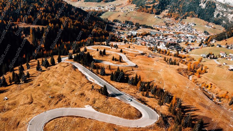 Autumn hued Mountain Town and Winding Road background image & Google Slides Theme