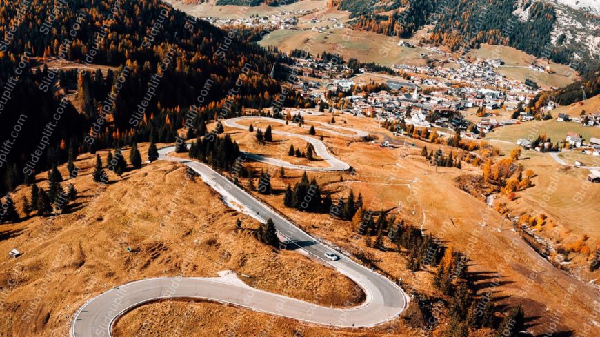 Autumn hued Mountain Town and Winding Road background image