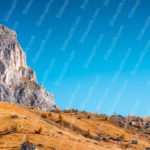 Azure Sky Mountainous Landscape Golden Meadow background image & Google Slides Theme