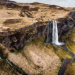 Beige Hills Waterfall background image & Google Slides Theme