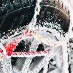 Black red yellow snowy tire with chains background image & Google Slides Theme