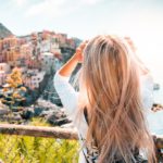 Blonde Hair Woman Coastal Village Scenic View background image & Google Slides Theme