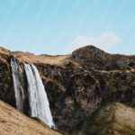 Blue White Waterfall Green Brown Mountain background image & Google Slides Theme