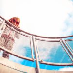 Blue and Red Child on Playground Structure background image & Google Slides Theme