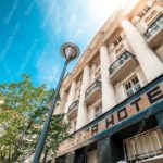 Blue sky white building green trees street lamp background image & Google Slides Theme